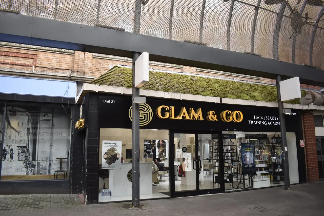 The Glam & Go shopfront at Unit 21 in the Treaty Centre, with its gold sign